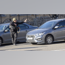 A soldier checks vehicles in Zhuliany neighborhood of Kyiv during Russia's invasion of Ukraine, on February 26, 2022.