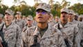 US Marine Corps recruits take part in the traditional Eagle, Globe and Anchor medal ceremony. (Photo by Robert Nickelsberg/Getty Images)