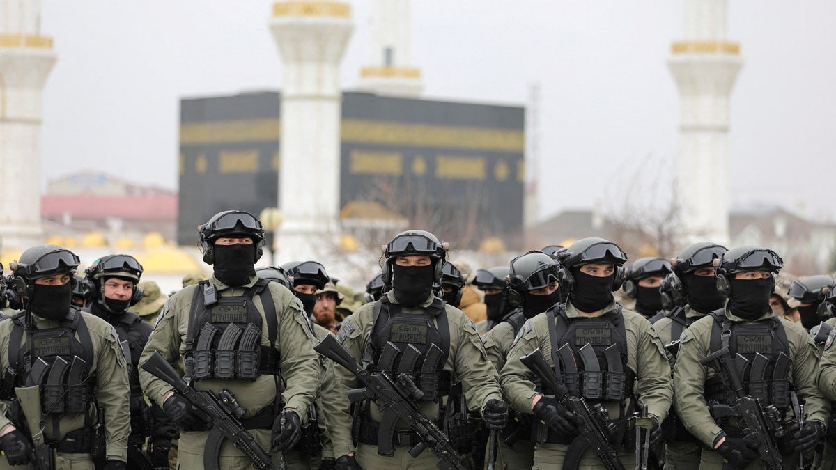 Service members gather in a square during head of the Chechen Republic Ramzan Kadyrov's address, dedicated to a military conflict in Ukraine, in Grozny, Russia, Feb. 25, 2022. 