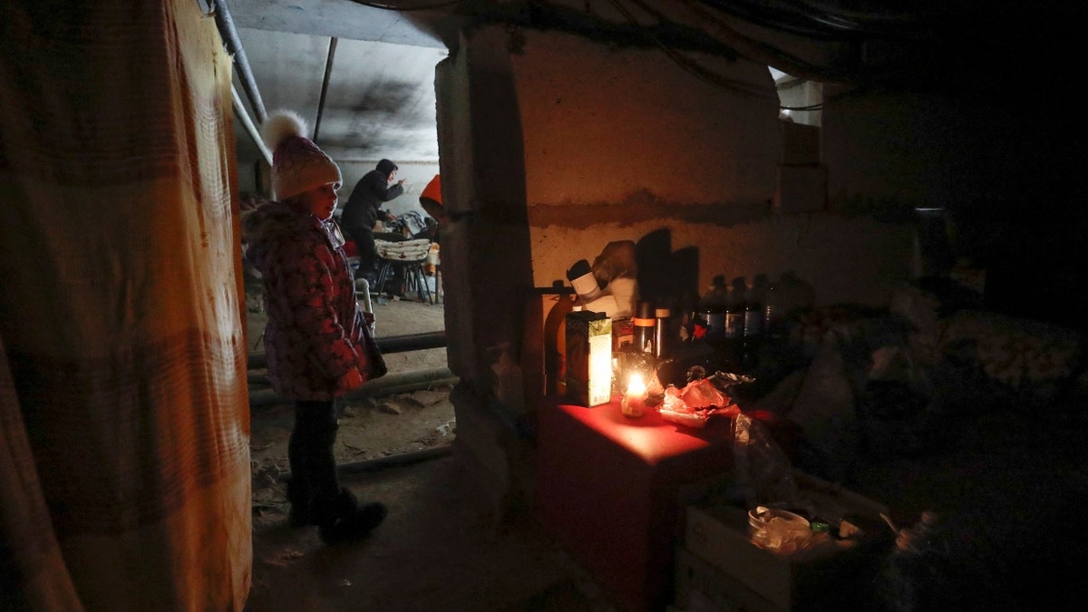 Local residents stay at a bomb shelter during Ukraine-Russia conflict in the besieged southern port city of Mariupol, Ukraine March 20, 2022. REUTERS/Alexander Ermochenko