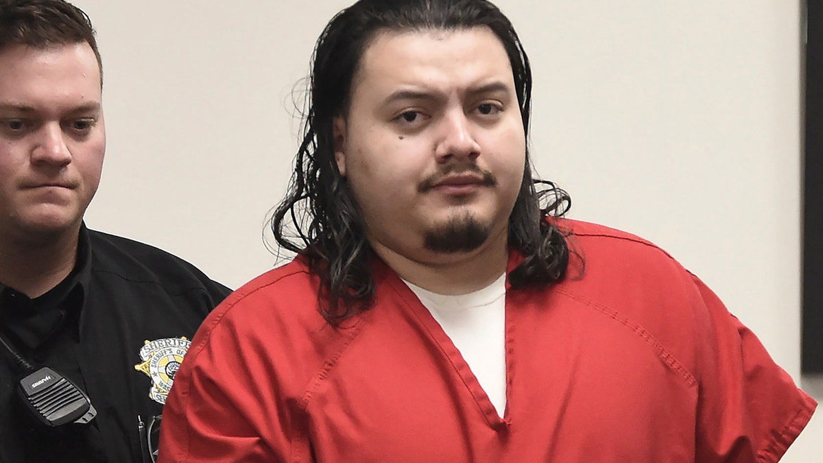 Wilber Ernesto Martinez Guzman enters the courtroom in Washoe County District Court in Reno on Monday, Feb. 28, 2022. 