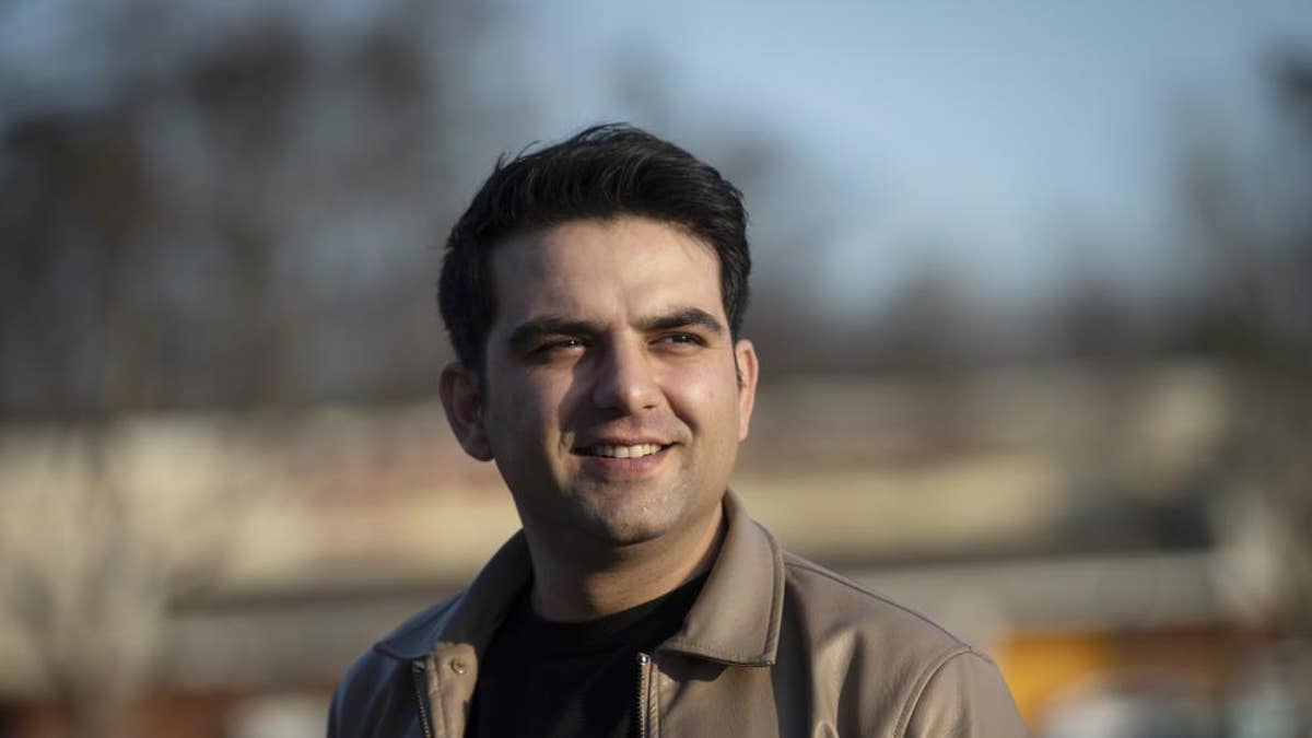 Afghan refugee Ahmad Saeed Totakhail poses for a photo in Dale City, Va., Wednesday, Feb. 16, 2022.