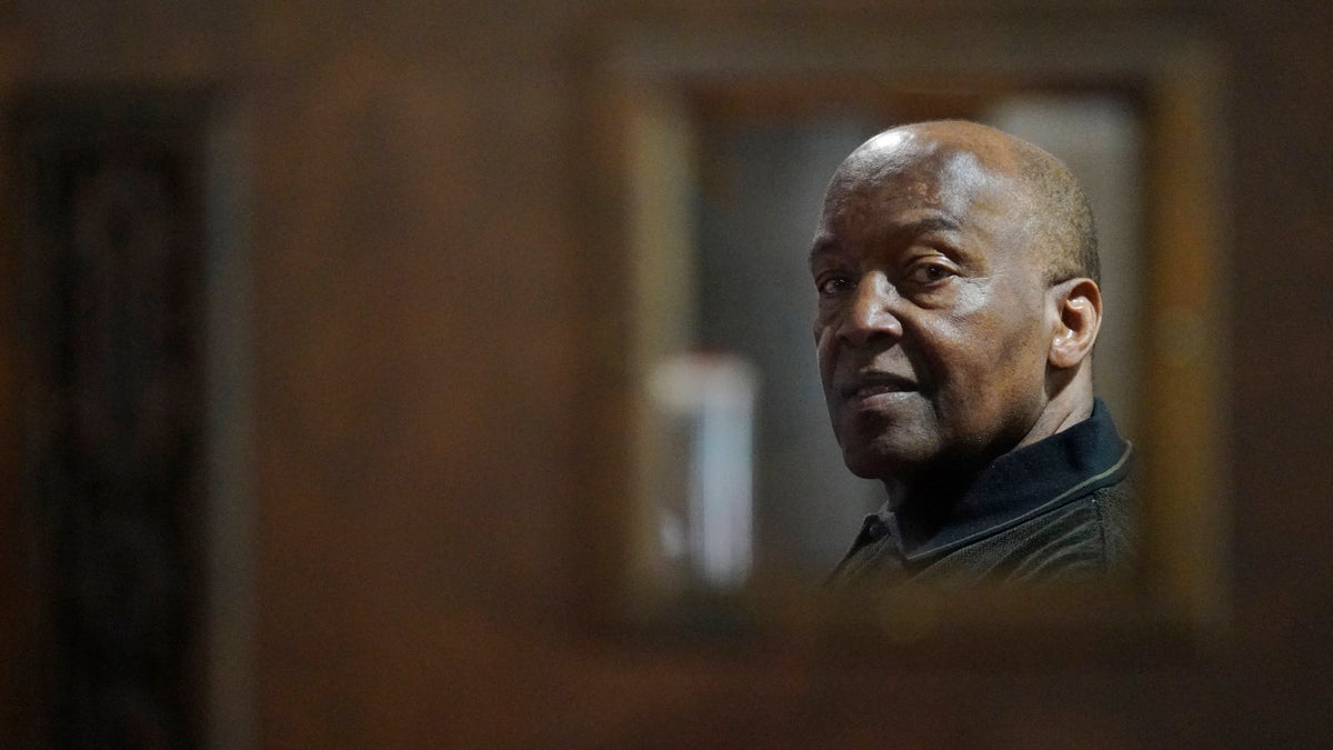Rev. David Bigsby poses for a photo at his church in Lansing, Ill.,