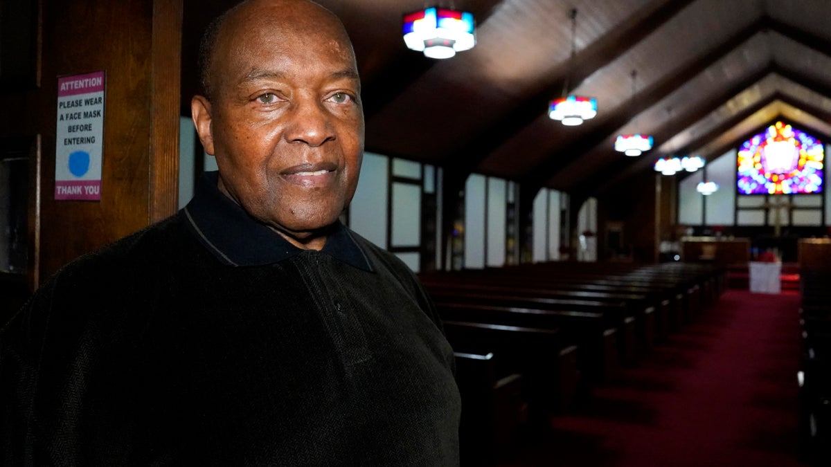 Rev. David Bigsby poses for a photo at his church in Lansing, Ill.