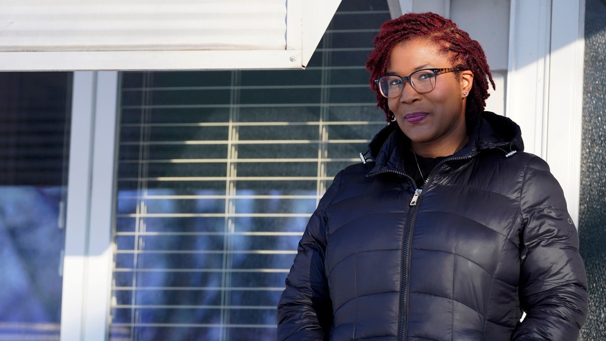 Sameerah Miller poses for a photo at her home in Lansing, Ill.
