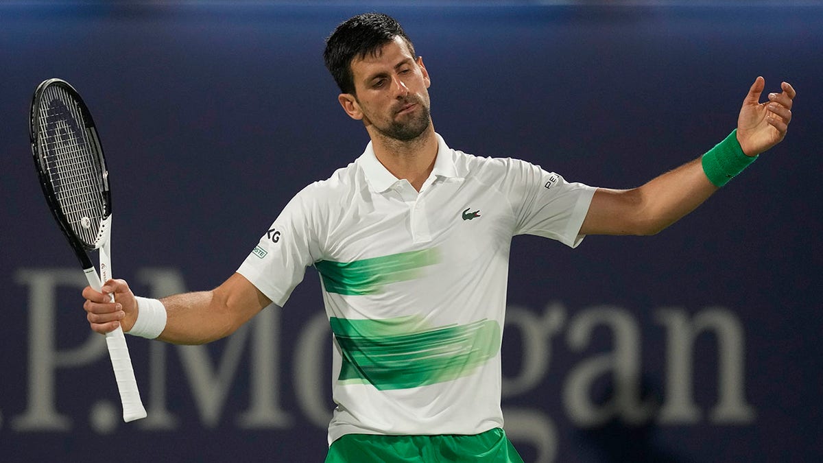 Serbia's Novak Djokovic reacts after he lost a point against Czech Republic's Jiri Vesely during a quarterfinal match of the Dubai Duty Free Tennis Championship in Dubai, United Arab Emirates, Thursday, Feb. 24, 2022.