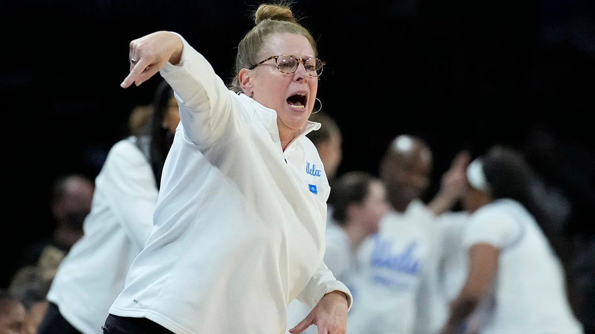 UCLA head coach Cori Close motions towards the court during the second half of an NCAA college basketball game against the Southern California in the first round of the Pac-12 women's tournament Wednesday, March 2, 2022, in Las Vegas.