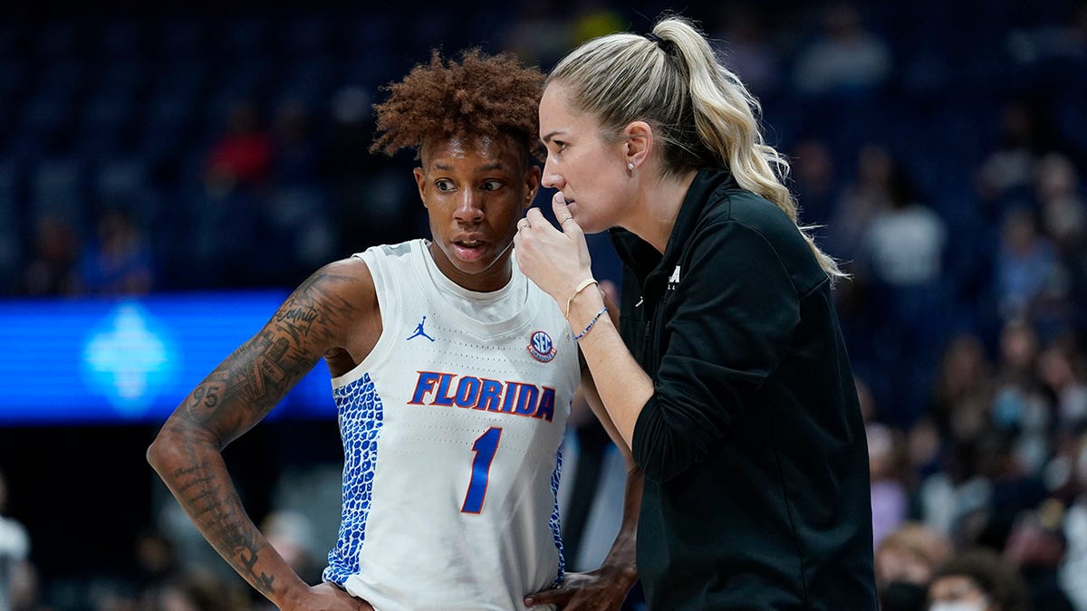 Florida head coach Kelly Rae Finley talks with Kiara Smith (1) in the first half of an NCAA college basketball game against Vanderbilt at the women's Southeastern Conference tournament Thursday, March 3, 2022, in Nashville, Tenn.