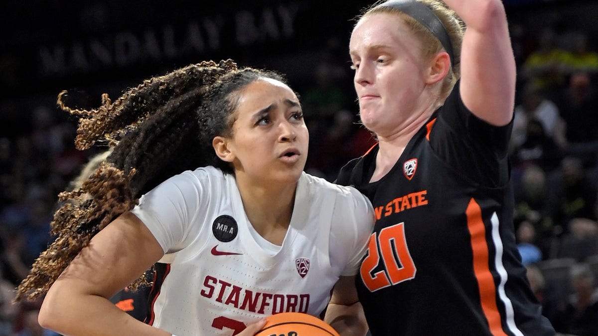 Stanford guard Haley Jones (30) drives with the ball as Oregon State forward Ellie Mack (20) defends during an NCAA college basketball game in the quarterfinals of the Pac-12 women's tournament Thursday, March 3, 2022, in Las Vegas.