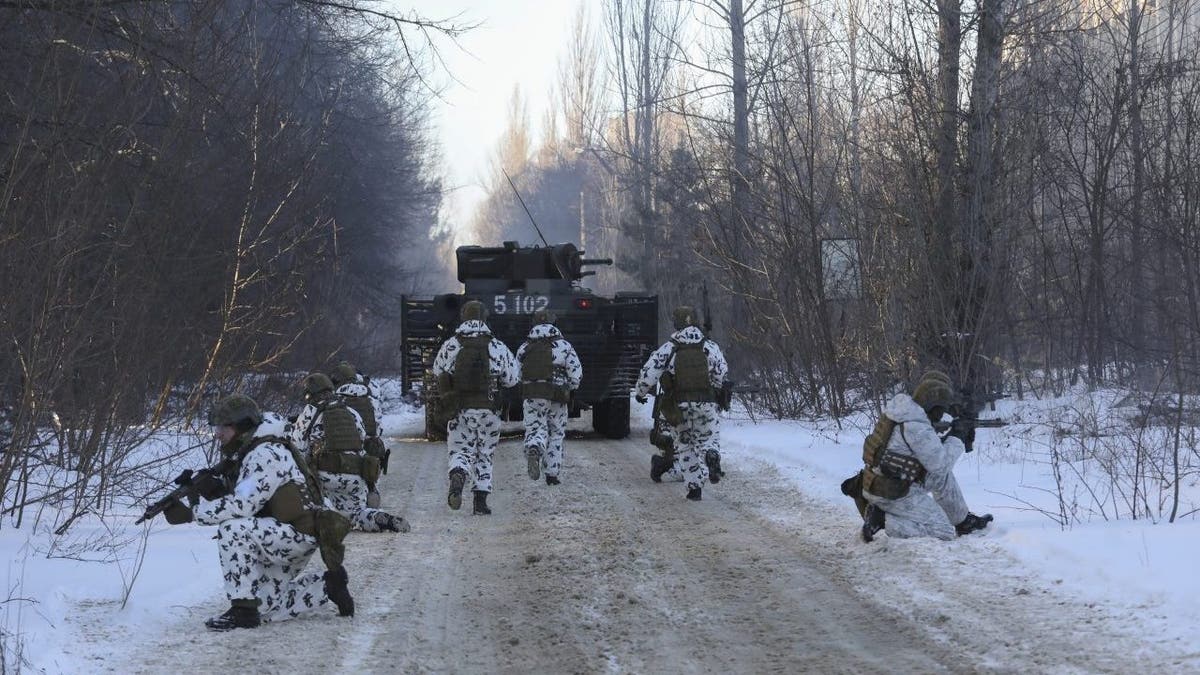 FILE - Ukrainian National Guard, Armed Forces, special operations units exercise as they simulate a crisis situation in an urban settlement, in the abandoned city of Pripyat near the Chernobyl Nuclear Power Plant, Ukraine, Feb. 4, 2022.