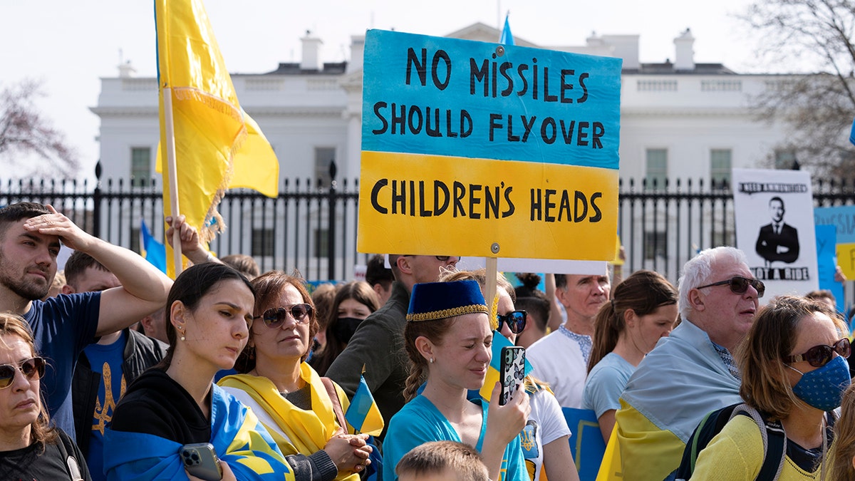 People protest the Russian invasion of Ukraine during a rally outside of the White House in Washington, Sunday, March 6.