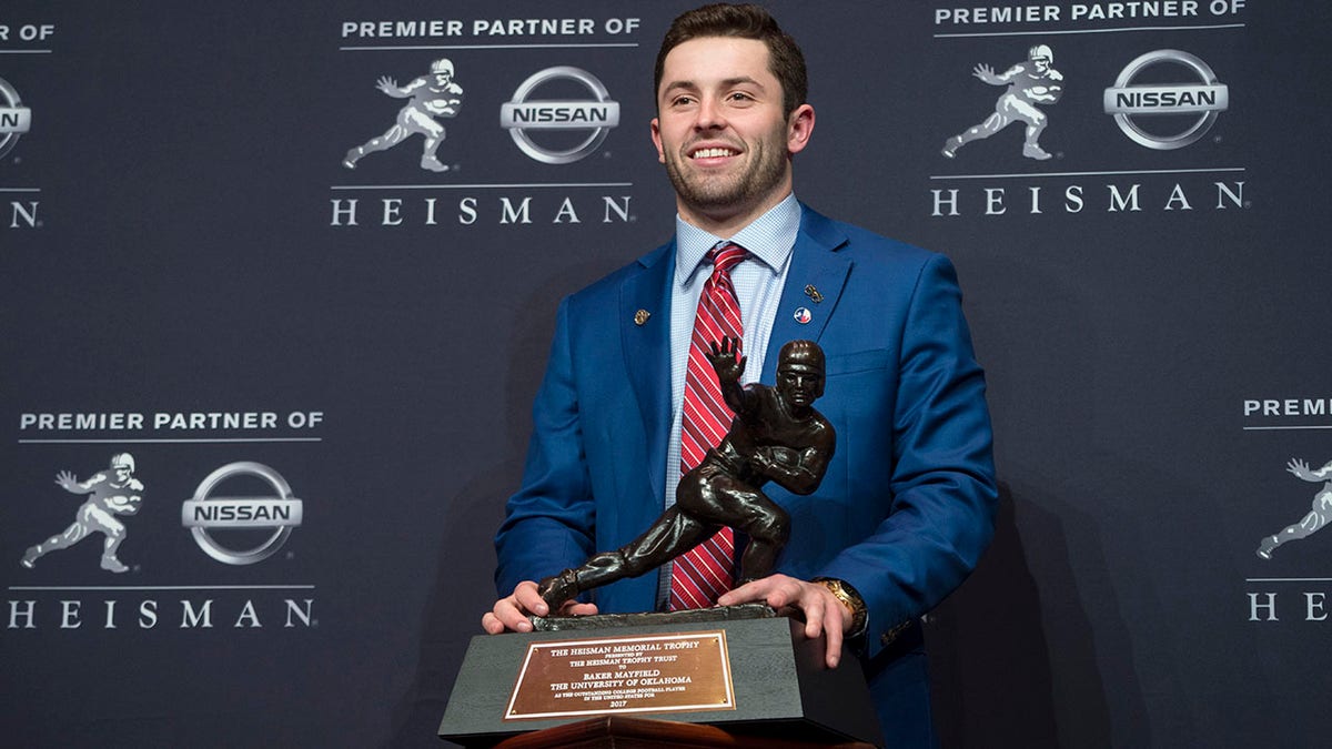 FILE - Oklahoma quarterback Baker Mayfield, winner of the Heisman Trophy, poses with the award Saturday, Dec. 9, 2017, in New York. Oklahoma has announced it will publicly dedicate a statue of 2017 Heisman Trophy winner Baker Mayfield on April 23, 2022, immediately following the school’s Spring Game. "I’m a Sooner for life and incredibly grateful for all of the success my teammates and I had at OU," Mayfield said in a statement. "It’s humbling and surreal to think about having a statue in iconic Heisman Park. I can’t wait to be back in Norman and reunite with the most passionate fans in college football."