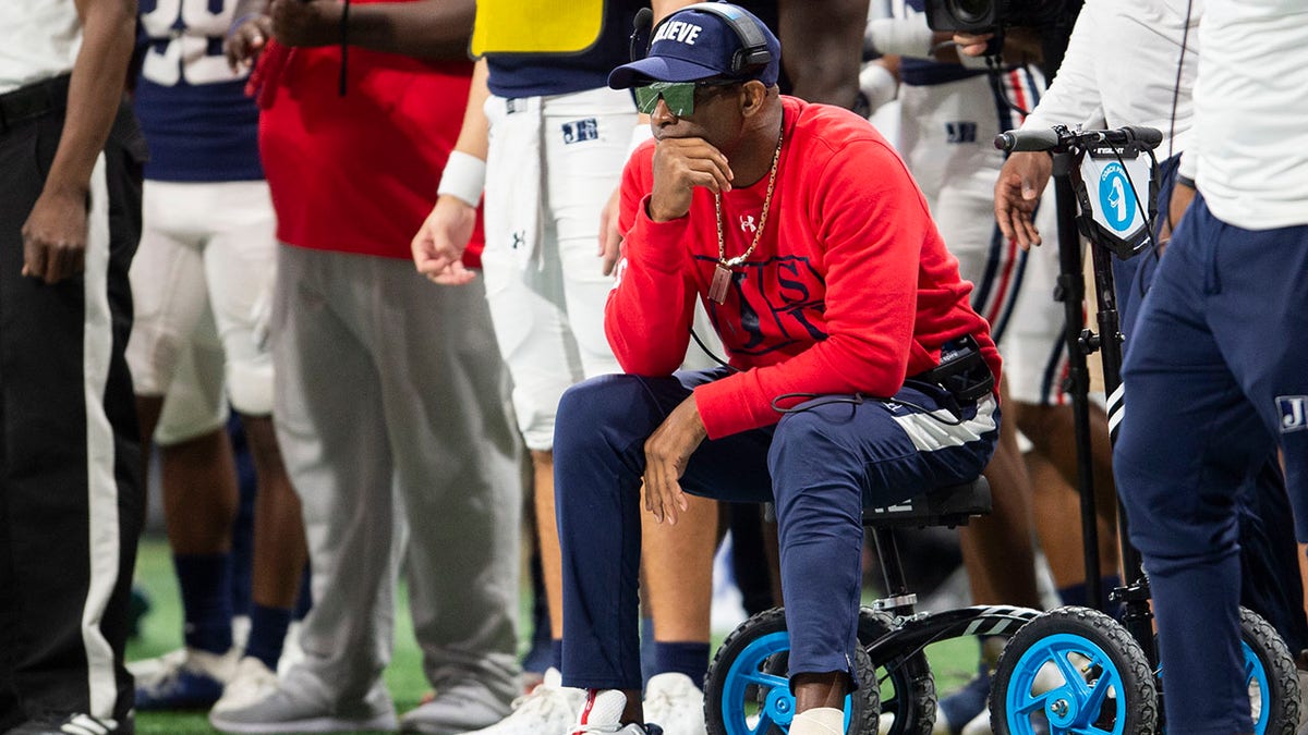 Deion Sanders watches game on the sideline