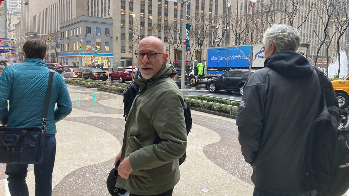 Chief union negotiator Bruce Meyer, center, and general counsel Ian Penny, right, leave Major League Baseball’s office in New York, Wednesday, March 9, 2022. Negotiators for locked-out players made their latest counteroffer to Major League Baseball on Wednesday. (AP Photo/Ron Blum)