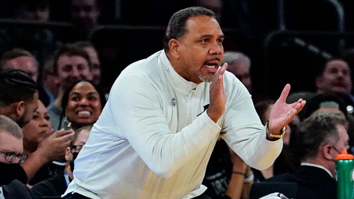 Providence head coach Ed Cooley claps for his players during the first half of an NCAA college basketball game against Butler at the Big East basketball tournament Thursday, March 10, 2022, in New York.