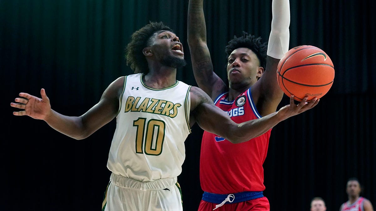 UAB guard Jordan Walker (10) goes in for a layup against Louisiana Tech guard Amorie Archibald (3) during the first half of an NCAA college basketball game for the Conference USA men's tournament championship in Frisco, Texas, Saturday, March 12, 2022.