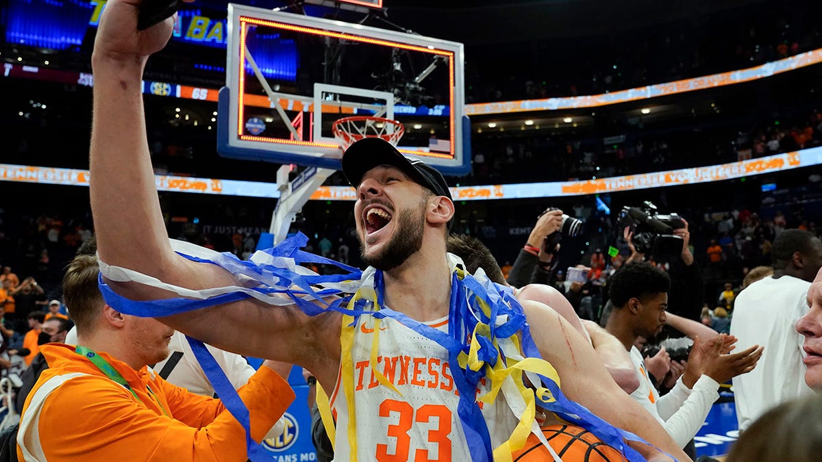 Tennessee forward Uros Plavsic (33) celebrates after the team defeated Texas A&amp;amp;M during an NCAA men's college basketball Southeastern Conference tournament championship game Sunday, March 13, 2022, in Tampa, Fla.