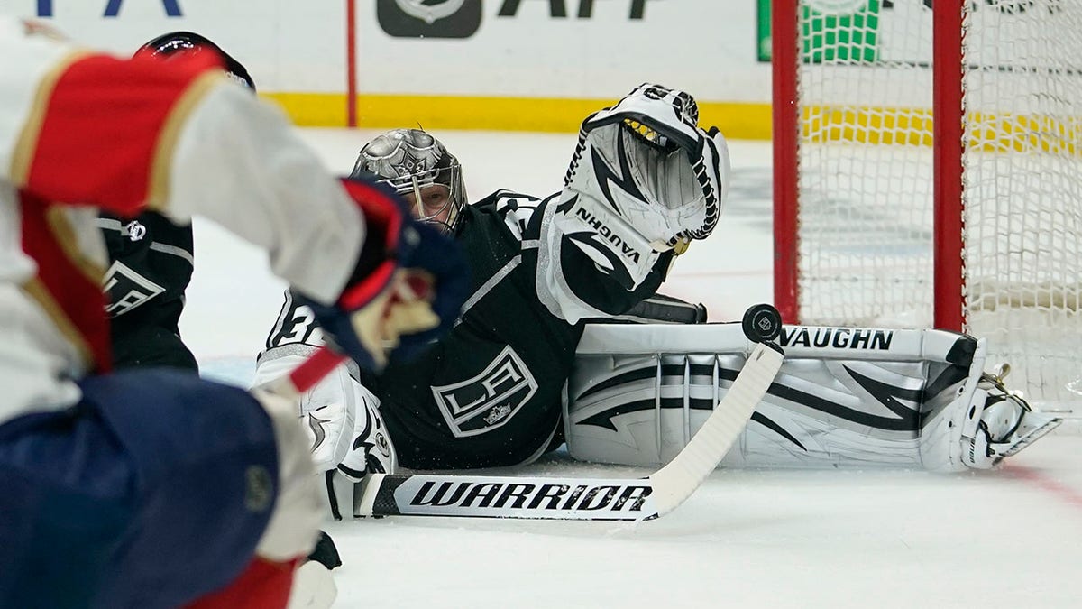 Los Angeles Kings goaltender Jonathan Quick (32) stops a shot from Florida Panthers left wing Anthony Duclair (10) during the first period of an NHL hockey game Sunday, March 13, 2022, in Los Angeles.