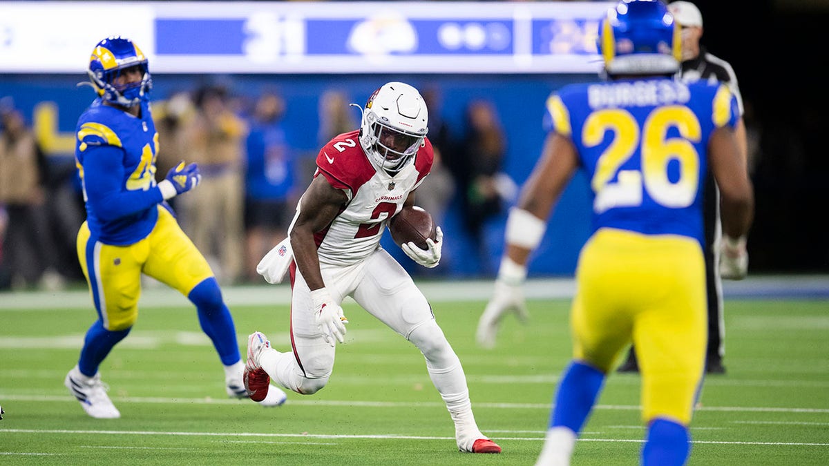 FILE - Arizona Cardinals running back Chase Edmonds (2) runs with the ball during an NFL wild-card playoff football game against the Los Angeles Rams on Monday, Jan. 17, 2022, in Inglewood, Calif. The Miami Dolphins agreed with Emmanuel Ogbah on a four-year contract and Chase Edmonds on a two-year deal on Monday, March 14, 2022.