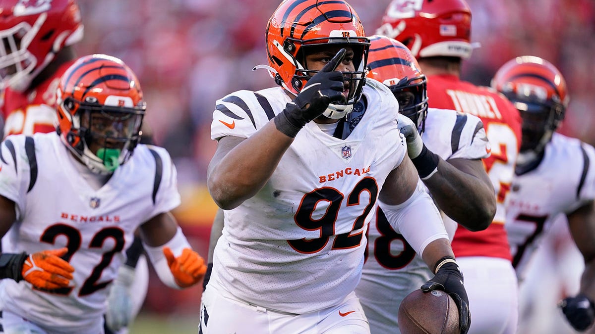 FILE - Cincinnati Bengals defensive end B.J. Hill (92) celebrates after intercepting a pass during the second half of the AFC championship NFL football game against the Kansas City Chiefs, Sunday, Jan. 30, 2022, in Kansas City, Mo. Hill has agreed to a free agent contract with the Bengals.
