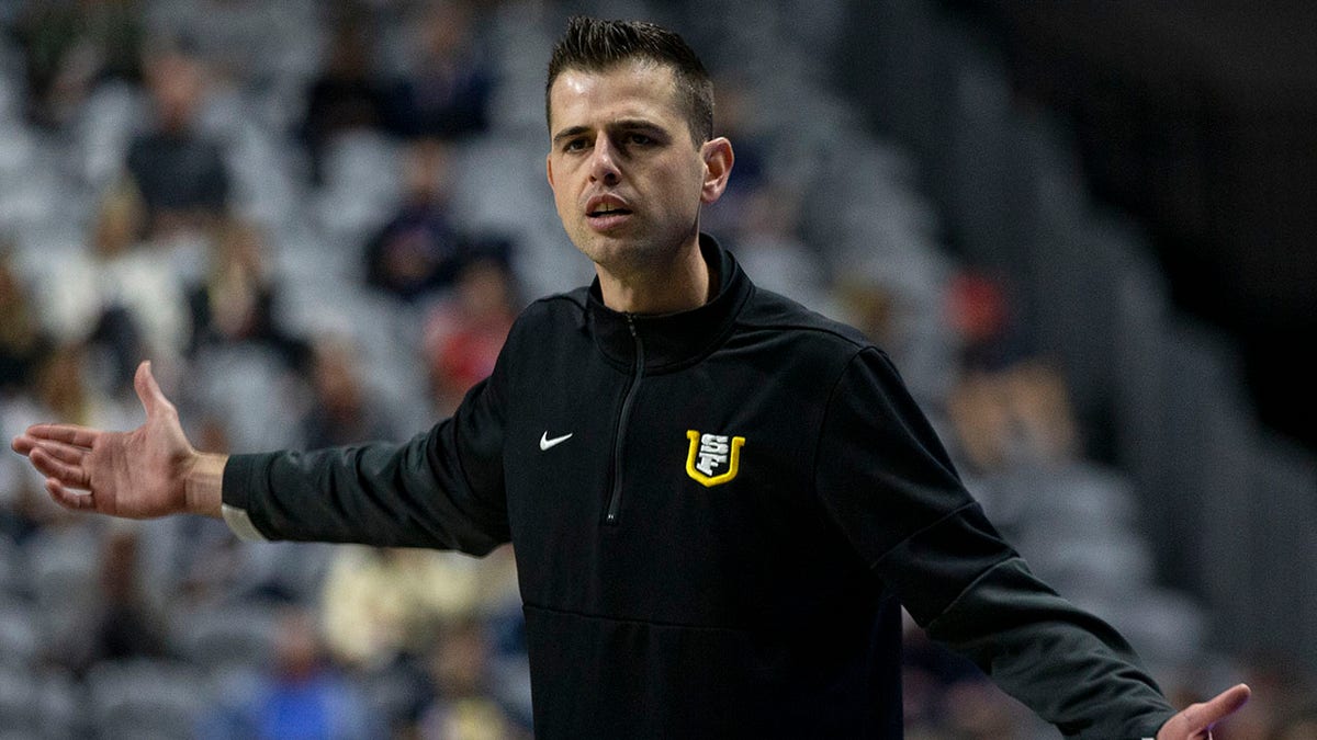 FILE - San Francisco head coach Todd Golden reacts to a referee's call during the second half of an NCAA semifinal college basketball game against Gonzaga at the West Coast Conference tournament March 7, 2022, in Las Vegas. To the core Golden knew his University of San Francisco team had done enough to earn an NCAA Tournament berth. It is just the coach had counted on a No. 9 seed and those were all gone with just four spots in the bracket remaining when the Dons were finally called.