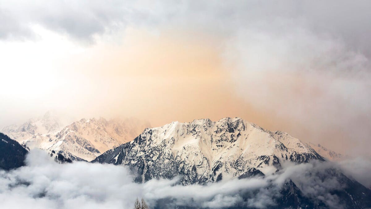 Dust from the Sahara desert can be seen above Le Catogne mountain as seen from Verbier, Switzerland.
