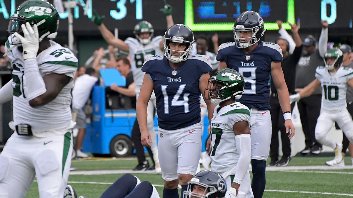 FILE - Tennessee Titans kicker Randy Bullock (14) reacts after missing a field goal and giving the win to the New York Jets during overtime of an NFL football game, Sunday, Oct. 3, 2021, in East Rutherford, N.J. Proposals to change the rules for overtime have been submitted by three NFL teams, with Tennessee seeking to include 2-point conversions as part of the process of deciding the winner, the league announced Wednesday, March 16, 2022.