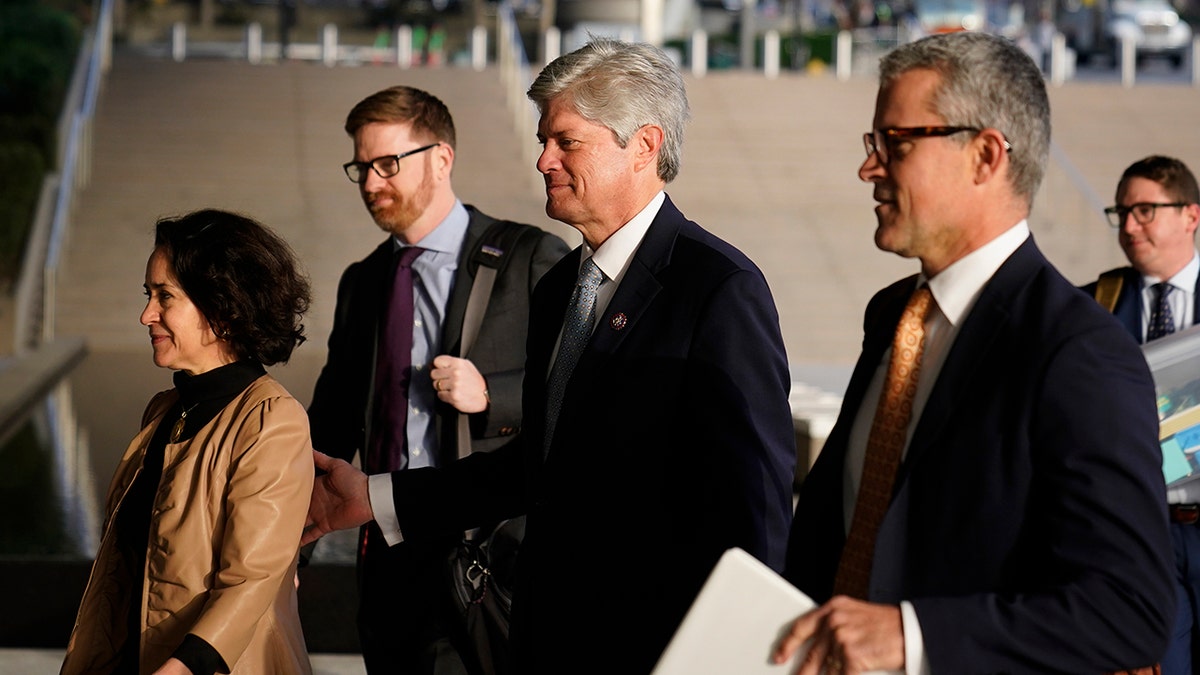U.S. Rep. Jeff Fortenberry, R-Neb., center, and wife, Celeste, left, arrive at the federal courthouse for his trial in Los Angeles, Wednesday, March 16, 2022. Fortenberry was convicted Thursday, March 24, 2022, of charges that he lied to federal authorities about an illegal $30,000 contribution to his campaign from a foreign billionaire at a 2016 Los Angeles fundraiser.(AP Photo/Jae C. Hong, File)