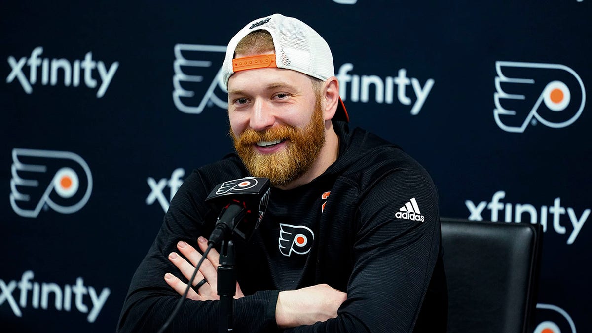 Philadelphia Flyers' Claude Giroux speaks with members of the media during a news conference at the team's NHL hockey practice facility, Wednesday, March 16, 2022 in Voorhees, N.J. Giroux's 1,000th career game with the Flyers on Thursday night could be his last in orange-and-black for the 34-year-old center approaching the final months of his contract.