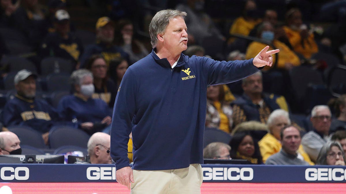 FILE - West Virginia coach Mike Carey gives instructions during the first half of an NCAA college basketball game against Baylor in Morgantown, W.Va., Saturday, Jan. 29, 2022. (Carey announced his retirement Wednesday, March 16, 2022, after 21 seasons with the Mountaineers.