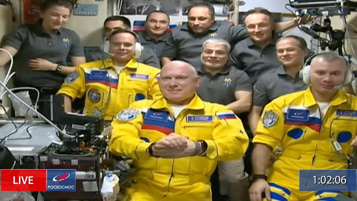 In this frame grab from video provided by Roscosmos, Russian cosmonauts Sergey Korsakov, Oleg Artemyev and Denis Matveyev are seen during a welcome ceremony after arriving at the International Space Station, Friday, March 18, 2022. (Associated Press)