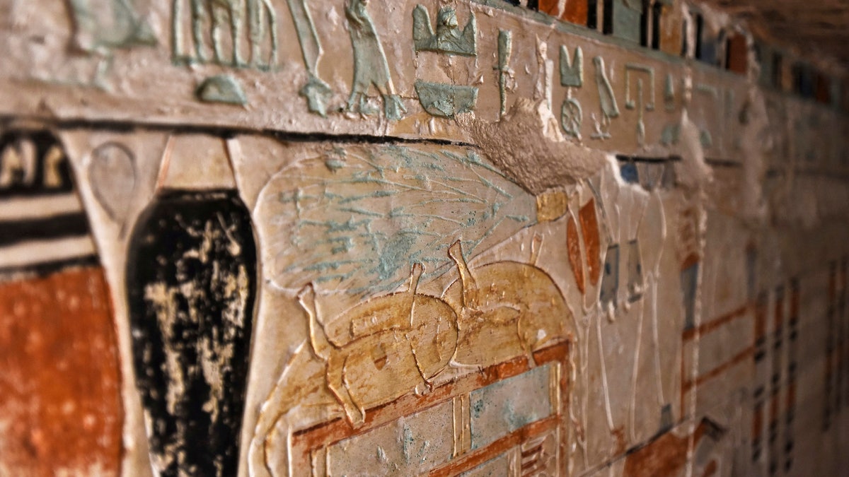 Walls decorated with hieroglyphic inscriptions and images of sacred animals are seen at a recently discovered tomb near the famed Step Pyramid, in Saqqara, south of Cairo, Egypt, Saturday, March 19, 2022.
