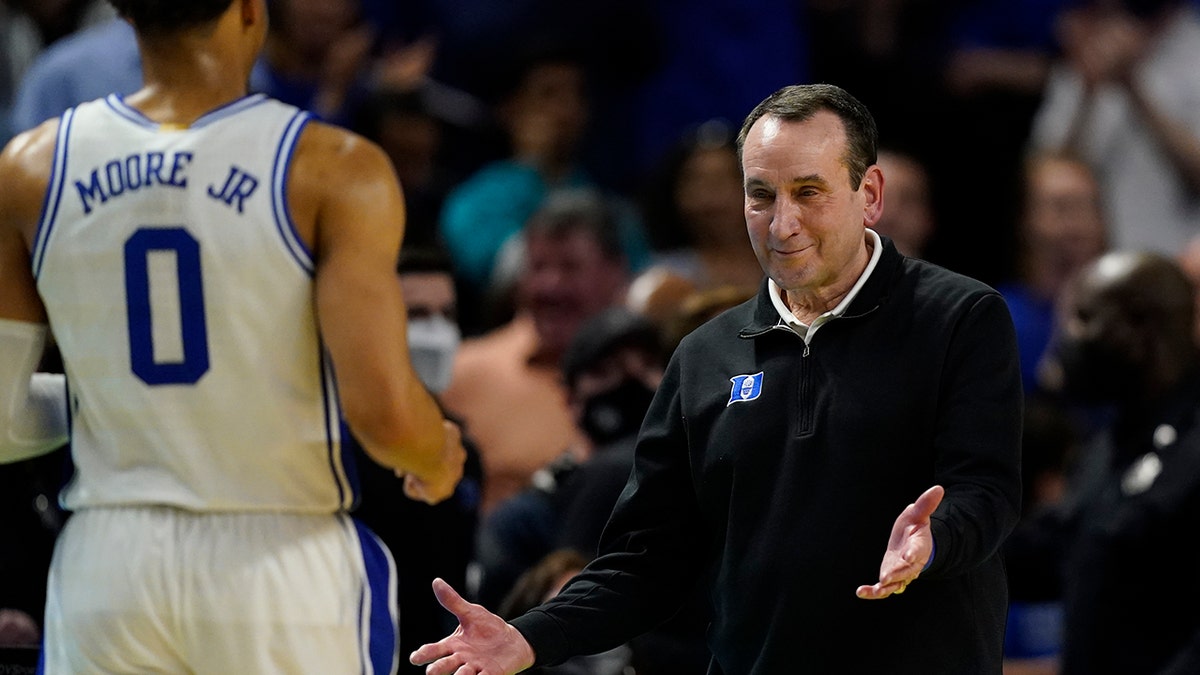 Duke head coach Mike Krzyzewski celebrates after their win against Michigan State with forward Wendell Moore Jr. during the second half of a college basketball game in the second round of the NCAA tournament on Sunday, March 20, 2022, in Greenville, S.C.