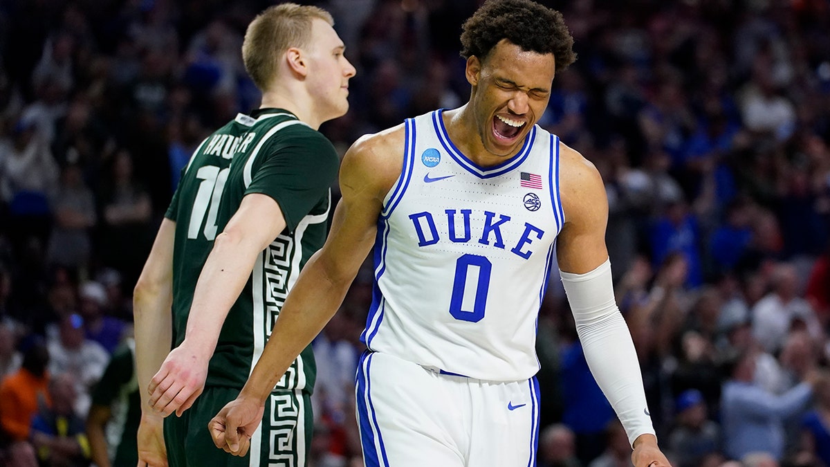 Duke forward Wendell Moore Jr. celebrates after their win as Michigan State forward Joey Hauser looks away during in a college basketball game in the second round of the NCAA tournament on Sunday, March 20, 2022, in Greenville, S.C.