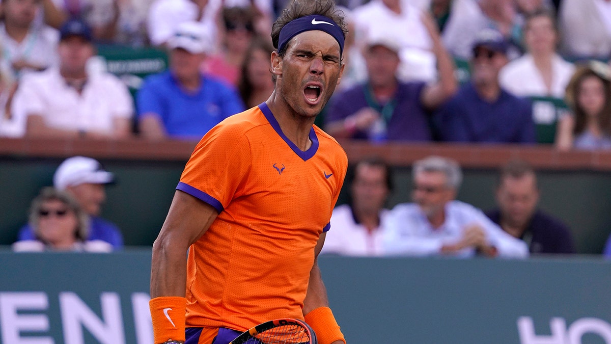 Rafael Nadal, of Spain, celebrates winning a point against Taylor Fritz during the men's singles finals at the BNP Paribas Open tennis tournament Sunday, March 20, 2022, in Indian Wells, Calif.