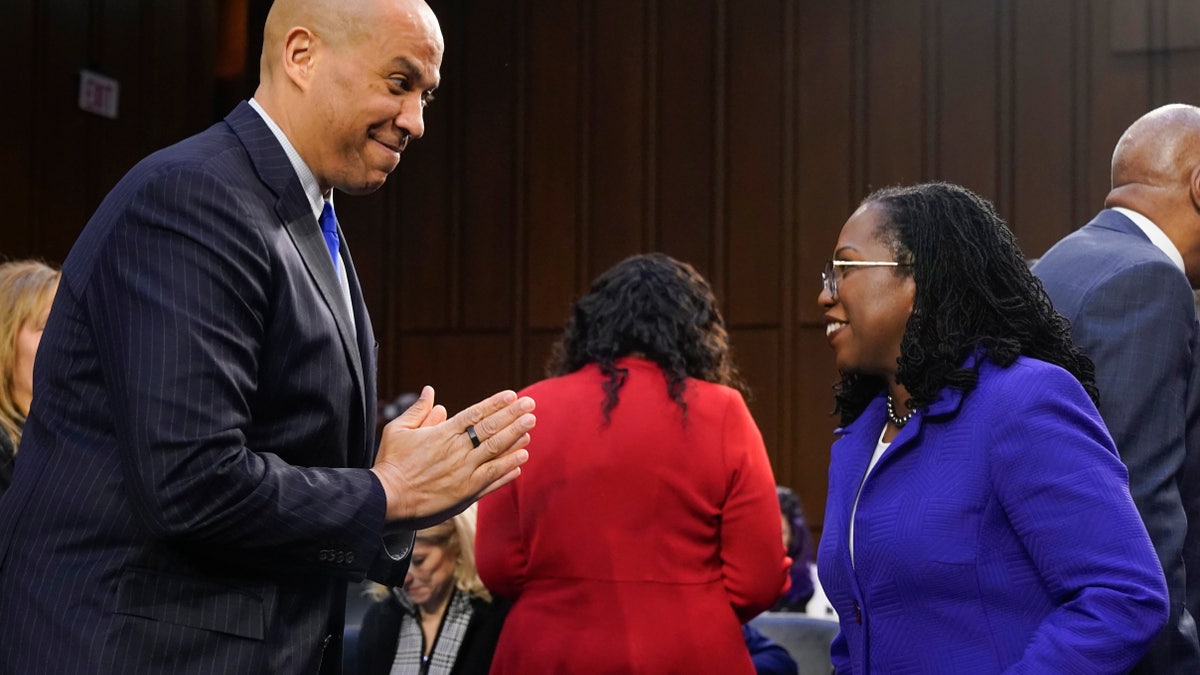 Supreme Court nominee Judge Ketanji Brown Jackson greets Sen. Cory Booker, D-N.J., as she arrives for her confirmation hearing before the Senate Judiciary Committee Monday, March 21, 2022, on Capitol Hill in Washington. (AP Photo/Jacquelyn Martin)