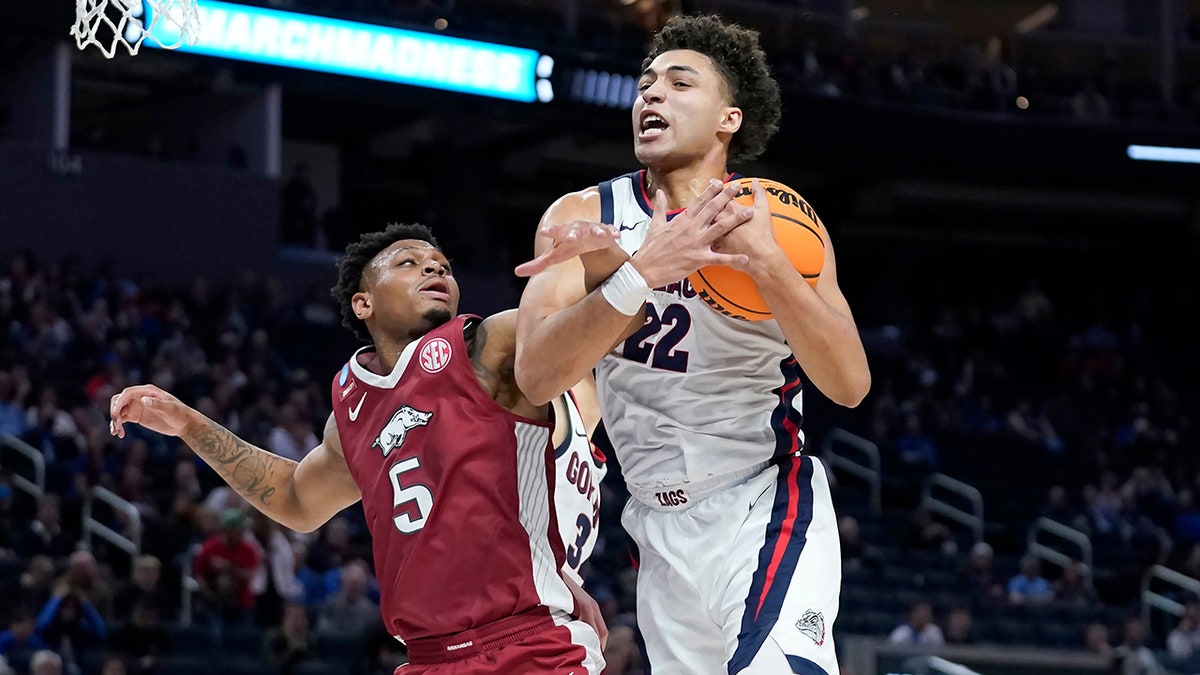 Gonzaga forward Anton Watson (22) grabs a rebound against Arkansas guard Au'Diese Toney (5) during the first half of a college basketball game in the Sweet 16 round of the NCAA tournament in San Francisco, Thursday, March 24, 2022.