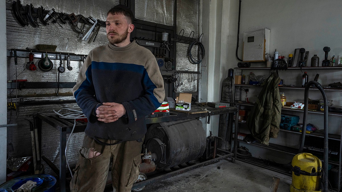 Car welder Ostap Datsenko, 31, pauses during an interview at a welding workshop in Lviv, western Ukraine, Sunday, March 27, 2022.