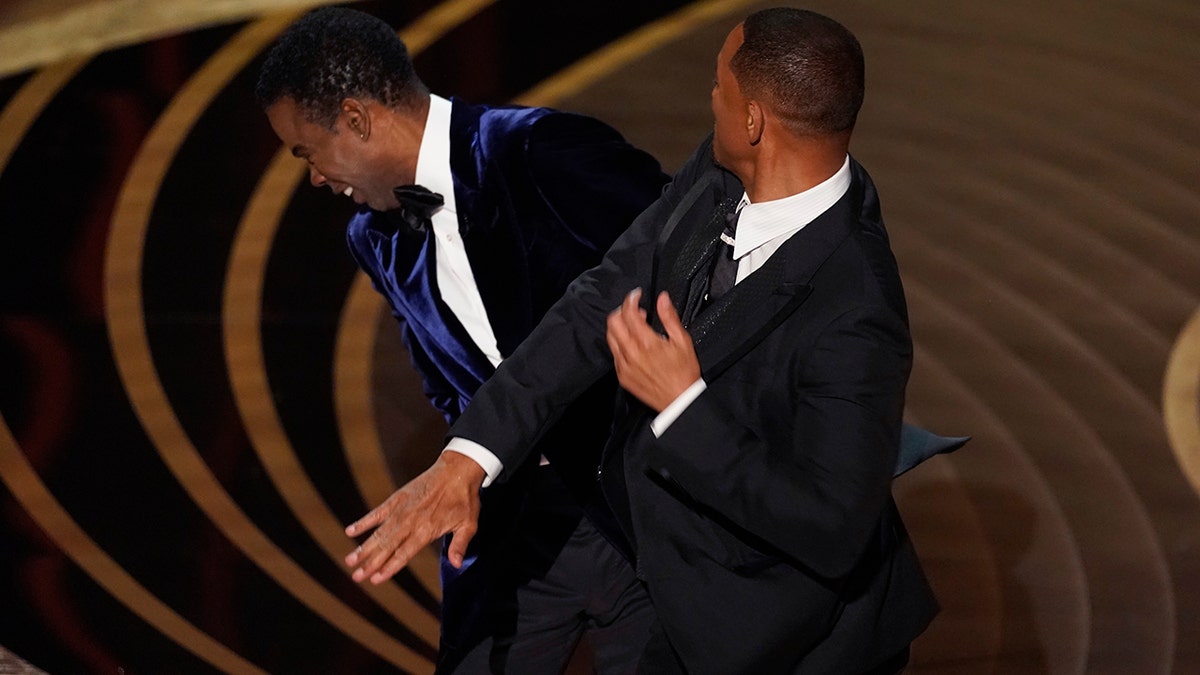 Will Smith slaps Chris Rock across the face