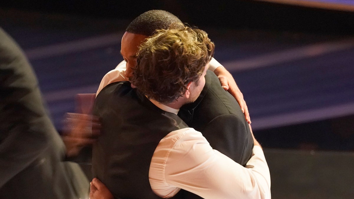 Bradley Cooper, left, and Will Smith appear in the audience at the Oscars on Sunday, March 27, 2022. (AP Photo/Chris Pizzello)