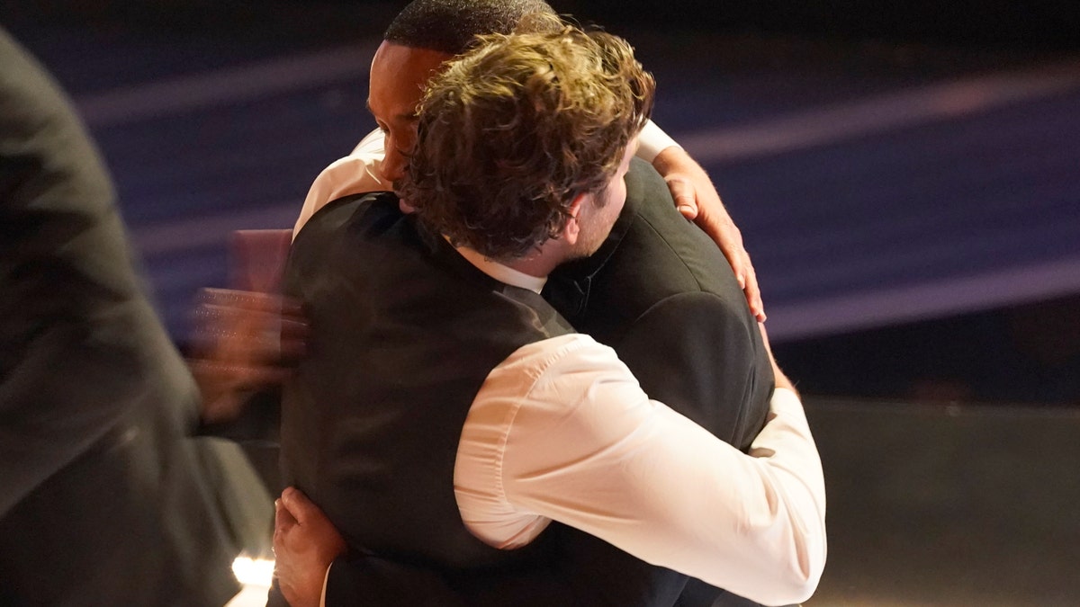 Bradley Cooper, left, and Will Smith appear in the audience at the Oscars on Sunday, March 27, 2022. (AP Photo/Chris Pizzello)