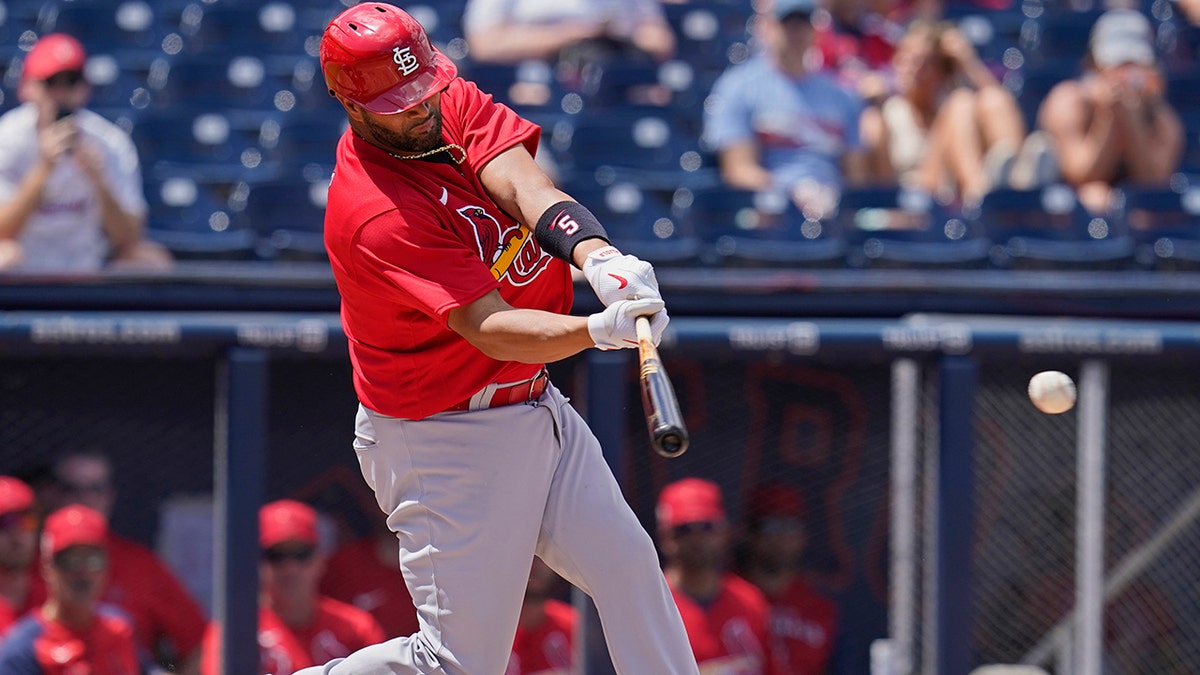 St. Louis Cardinals' Albert Pujols singles in the fourth inning of a spring training baseball game against the Washington Nationals, Wednesday, March 30, 2022, in West Palm Beach, Fla. 