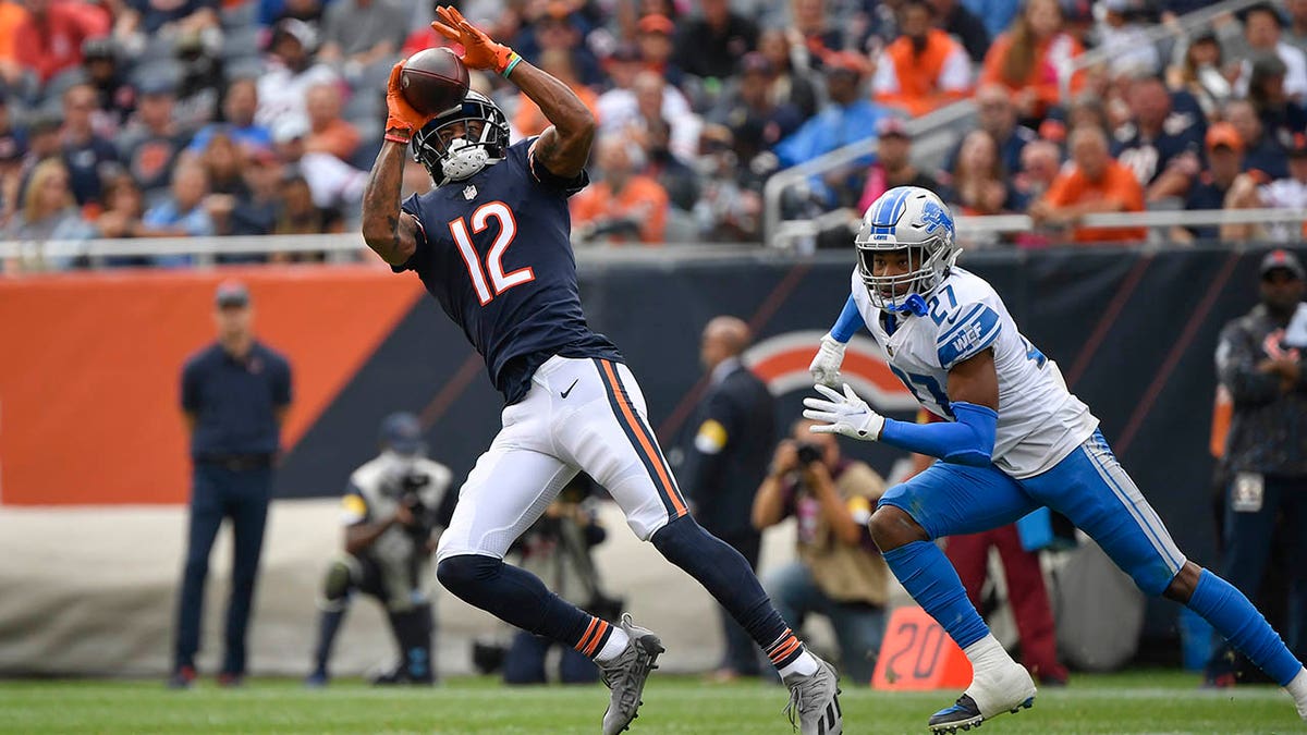 Oct 3, 2021; Chicago, Illinois, USA; Chicago Bears wide receiver Allen Robinson (12) catches the ball for a first down in the second half against Detroit Lions defensive back Bobby Price (27) at Soldier Field.