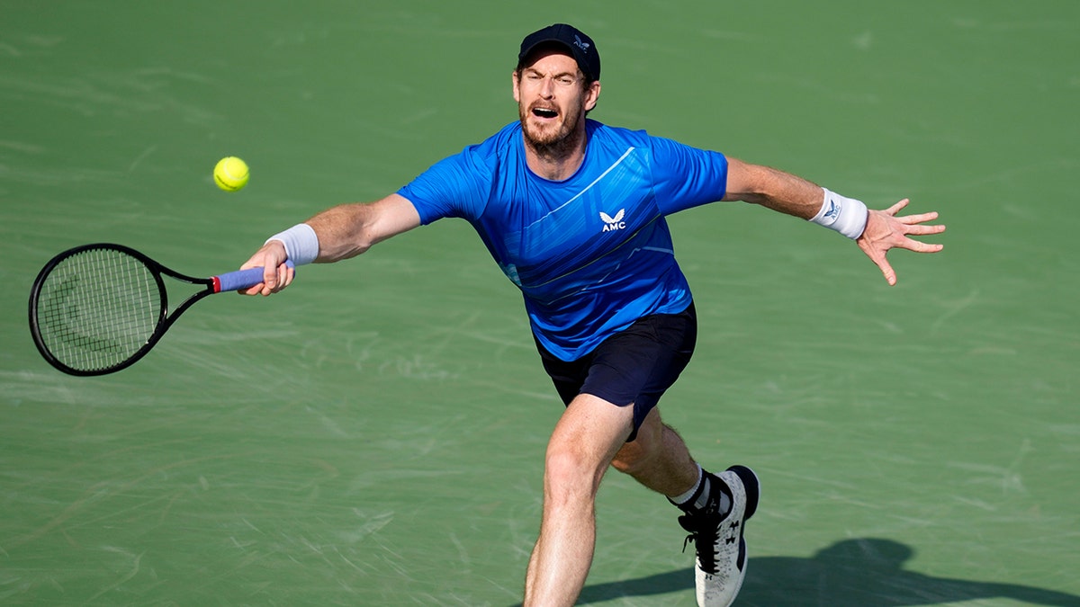 Andy Murray of Britain return the ball to Italy's Jannik Sinner during a match of the Dubai Duty Free Tennis Championship in Dubai, United Arab Emirates, Wednesday, Feb. 23, 2022.