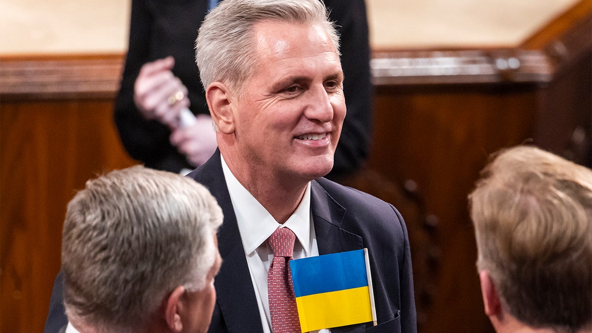 House Minority Leader Kevin McCarthy of Calif., wears a Ukrainian flag in his pocket in the chamber of the House of Representatives before the State of the Union address by President Biden to a joint session of Congress at the Capitol, Tuesday, March 1, 2022, in Washington.. 