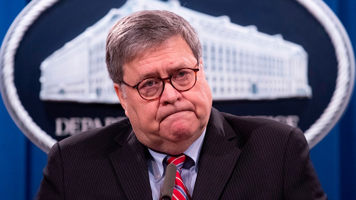 FILE - Attorney General William Barr looks on during a news conference at the Department of Justice in Washington, Dec. 21, 2020. (Photo by MICHAEL REYNOLDS/POOL/AFP via Getty Images)