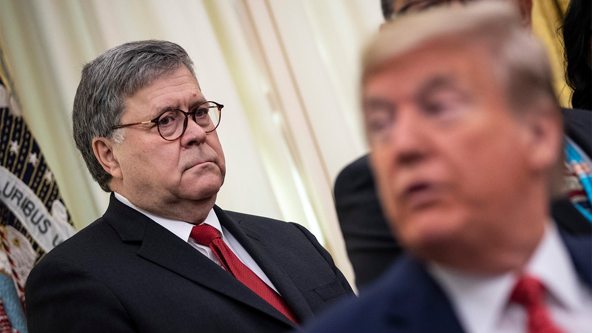 Attorney General William Barr and President Trump attend a signing ceremony for an executive order establishing the Task Force on Missing and Murdered American Indians and Alaska Natives, in the Oval Office of the White House