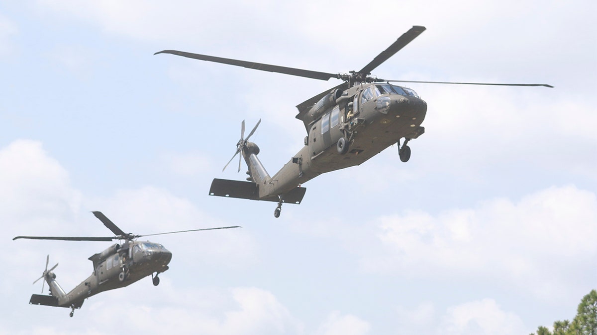 Two UH-60 Black Hawk helicopter assigned to the 2nd Assault Helicopter Battalion, 82nd Combat Aviation Brigade prepare to land on flight strip 2 to perform sling load operations with students assigned to the DeGlopper Air Assault School, XVIII Airborne Corps on Fort Bragg, N.C., April 20. (U.S. Army photo by Sgt. Steven Galimore)