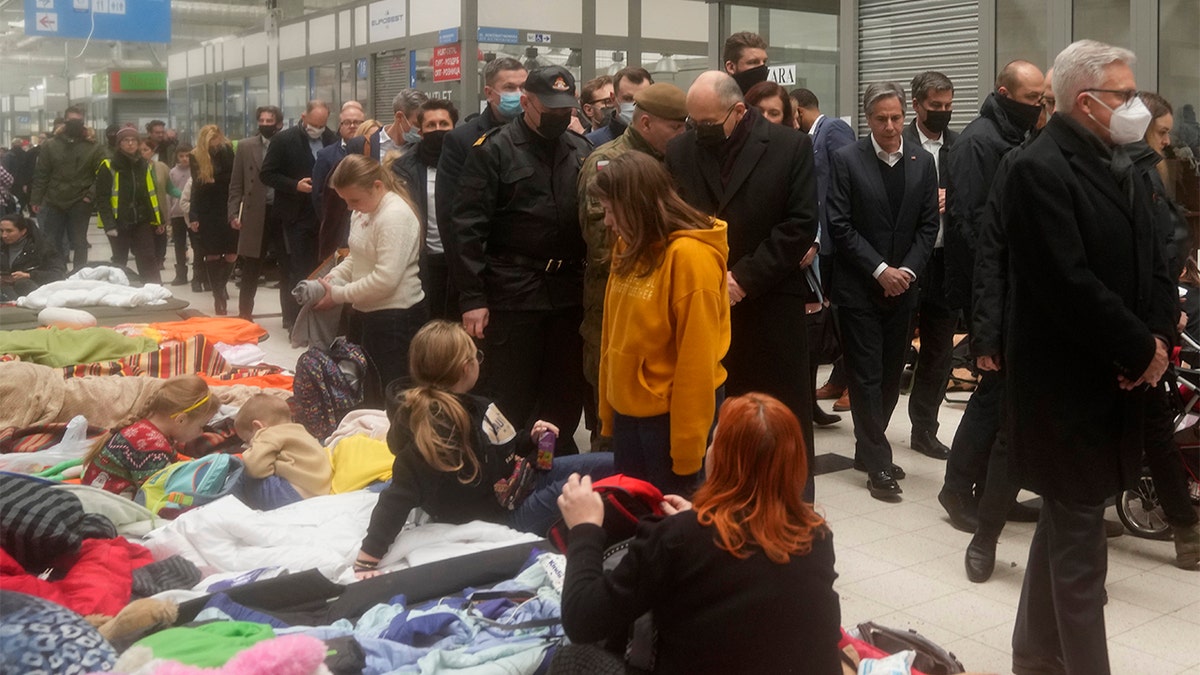 U.S. Secretary of State Antony Blinken, center right, tours a reception center for displaced persons from Ukraine, at the Ukrainian-Polish border crossing in Korczowa, Poland, Saturday, March 5, 2022. (AP Photo/Markus Schreiber)