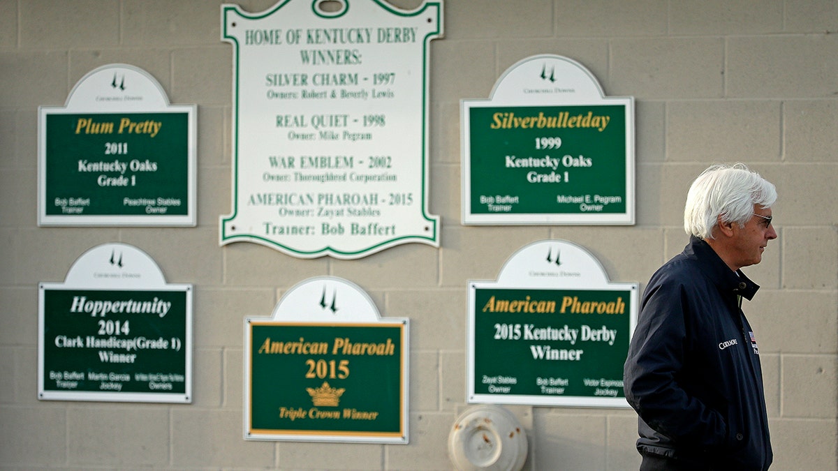 FILE - Trainer Bob Baffert stands outside his barn at Churchill Downs Monday, May 2, 2016, in Louisville, Ky.